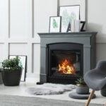 Stylish living room interior with electric fireplace and comfortable furniture