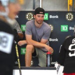 Boston-07/02/2024 The Boston Bruins held a development camp at Warrior Ice Arena. Bruins goalie Jeremy Swayman in shorts and a t-shirt looks on from the bench.
